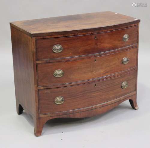 A late George III mahogany bowfront chest of three graduated long drawers, on bracket feet, height