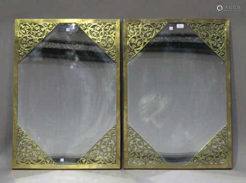 A pair of 19th century and later rectangular brass framed wall mirrors, the pierced foliate frames