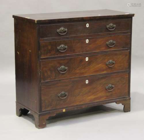 A George III mahogany and crossbanded chest of four long drawers, on bracket feet, height 101cm,
