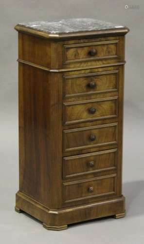 An early 20th century French walnut narrow bedside chest of drawers, the grey marble top above a