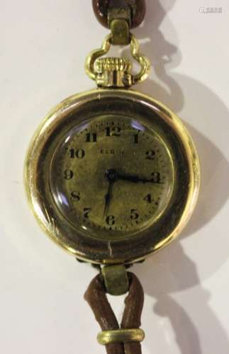 An Elgin USA gilt metal cased keyless wind open-faced pendant fob watch, converted for wear as a