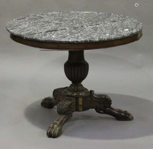 A late 19th/early 20th century French mahogany circular centre table with grey marble top, raised on