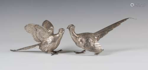 A pair of Elizabeth II silver models of cock and hen pheasants, each with engraved feather
