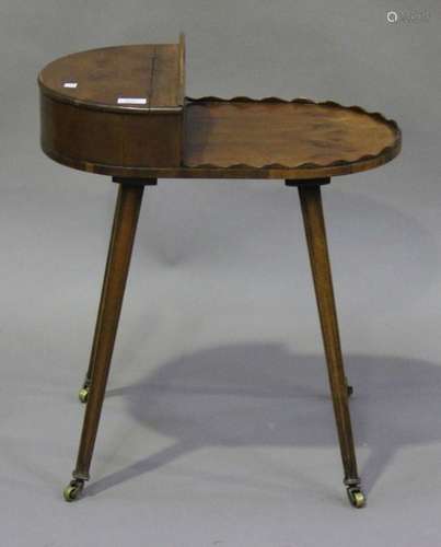 A mid-20th century Regency style yew work table with hinged compartment and pierced carrying handle,