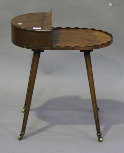 A mid-20th century Regency style yew work table with hinged compartment and pierced carrying handle,