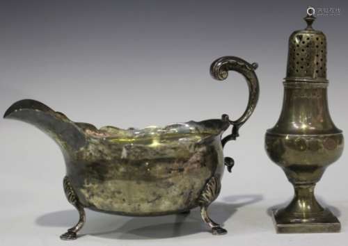 An early George III silver sauce boat with foliate capped flying scroll handle, London 1765 by