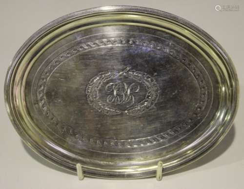 A George III silver oval teapot stand, monogram engraved within a ropetwist engraved border,