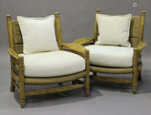 A pair of large modern Eastern wooden framed armchairs with cane backs, on turned legs, height