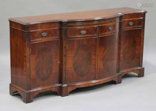 A 20th century reproduction mahogany break-bowfront sideboard, height 82cm, width 168cm, depth 47cm,