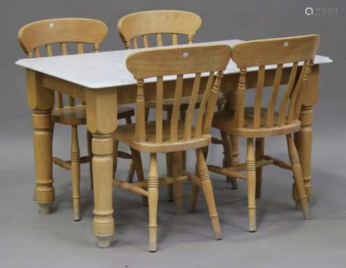 A late 20th century pine kitchen table with white marble top, on turned legs, height 72cm, length