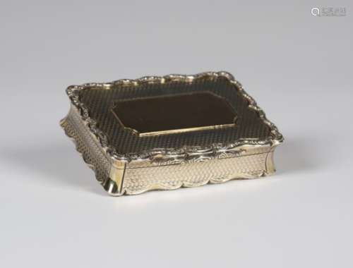 A Victorian silver shaped rectangular snuff box with engine turned decoration within raised cast