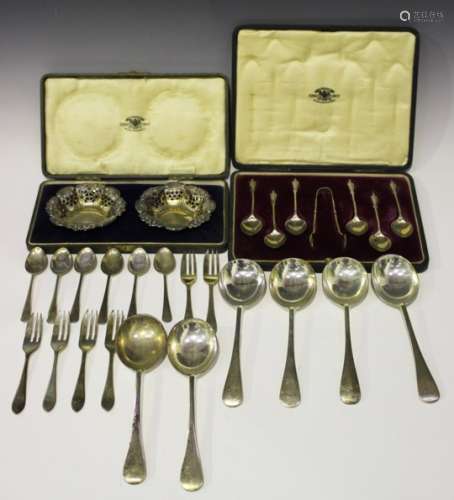 A set of six George V silver gilt apostle teaspoons and a pair of matching sugar tongs, London