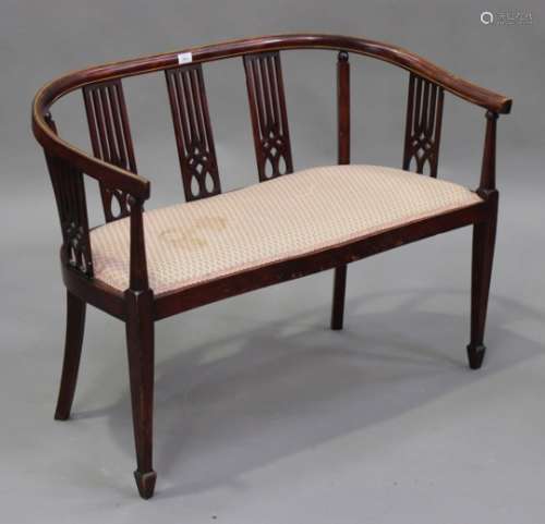 An Edwardian stained beech and line inlaid salon settee, on square tapering legs and spade feet,