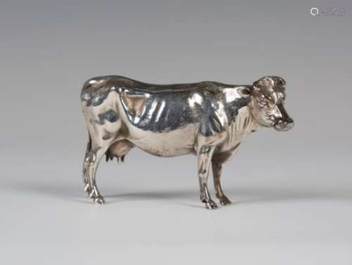 A Victorian silver model of a standing cow, London 1889 by Edward H. Stockwell, length 11.5cm.