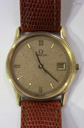 An Omega Quartz 9ct gold circular cased gentleman's wristwatch, the signed textured gilt dial with