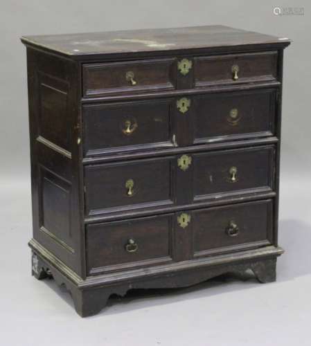 A late 17th century walnut chest of two short and three long drawers, on bracket feet, height 105cm,