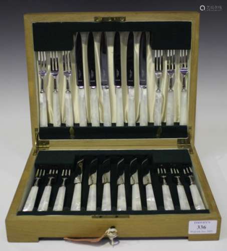 A set of twelve plated and mother-of-pearl handled fruit knives and forks by Asprey, cased.Buyer’s