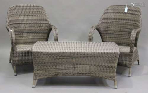 A modern four-piece suite of garden furniture by Bridgman, comprising a settee, two armchairs and