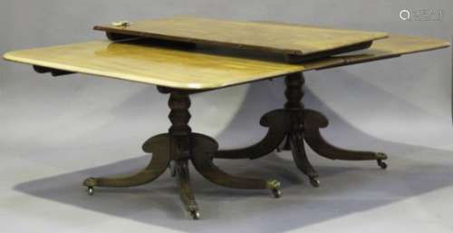A late George III mahogany dining table, the top with extra leaf, both ends with tip-top mechanisms,