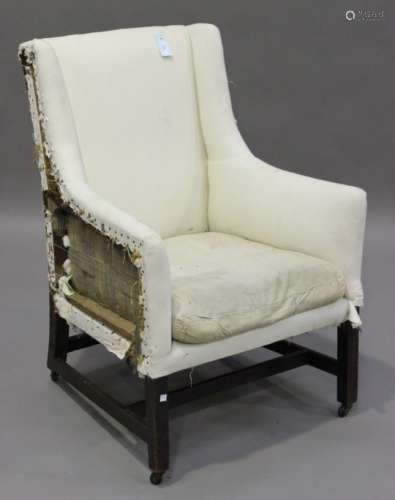 A George III mahogany framed armchair, the winged sides raised on block legs, height 98cm, width