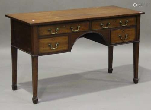 A 19th century mahogany kneehole writing table, fitted with four drawers, on square tapering legs,