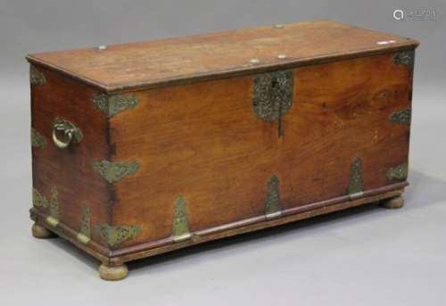 A 19th century Eastern teak and brass mounted chest, fitted with carrying handles, height 61cm,