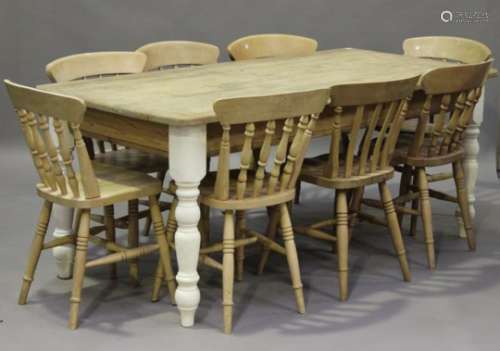 A modern pine rectangular kitchen table, on painted legs, height 77cm, length 183cm, depth 91cm,