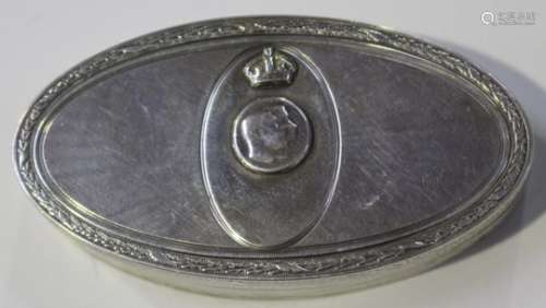 An Edwardian silver oval snuff box and cover with engine turned decoration, the cover later