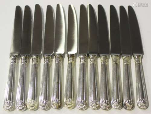 A set of twelve Elizabeth II silver handled Old English Thread and Shell pattern table knives with