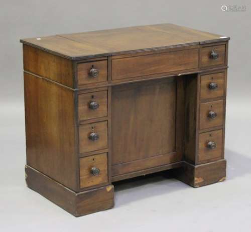 An early 19th century mahogany campaign dressing chest of drawers, the hinged top revealing a mirror