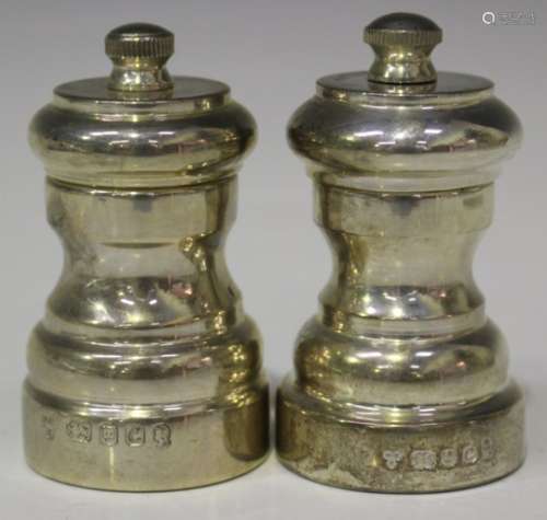 Two Elizabeth II silver pepper mills, each of baluster form, London 1977 by Da-mar Silverware,