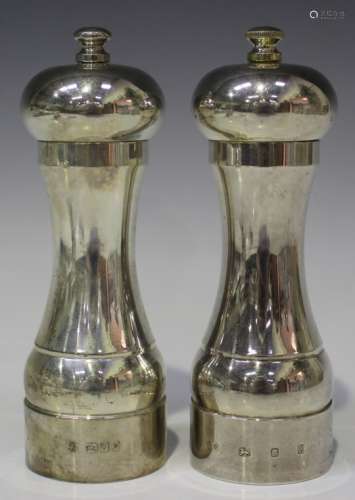 An Elizabeth II silver pepper mill and salt mill, each of baluster form, London 1984 by Bruford &