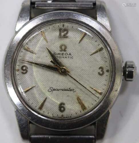 An Omega Automatic Seamaster steel cased gentleman's wristwatch, the signed textured cream dial with