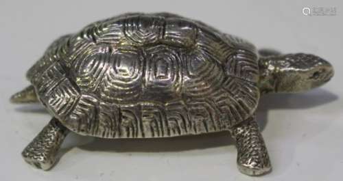 An Elizabeth II silver model of a tortoise, London 1965 by Wakely & Wheeler, length 5.5cm.Buyer’s