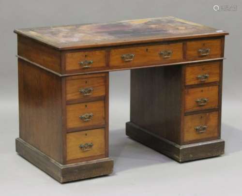 A late Victorian walnut twin pedestal desk, fitted with nine drawers, on a plinth base, height 74cm,