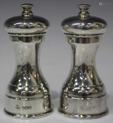 A pair of Elizabeth II silver novelty salts in the form of pepper mills, Sheffield 1975 by A.