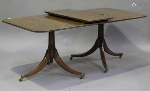 A mid-20th century Regency style mahogany 'D' end dining table, fitted with a single extra leaf,