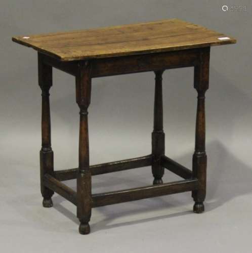 An 18th century and later fruitwood table, the rectangular top on turned and block legs, height