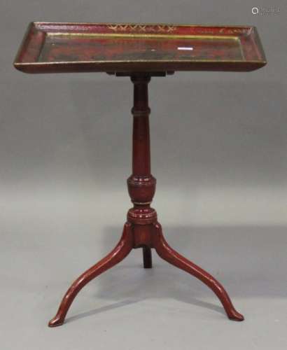 An early 19th century red chinoiserie tip-top table, the dished rectangular top gilt decorated