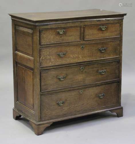 An early 18th century oak chest of two short and three graduated long drawers, on bracket feet,
