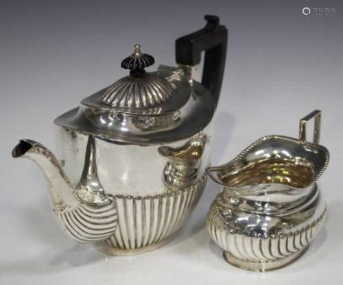 An Edwardian silver oval half-reeded teapot, Chester 1907 by George Nathan & Ridley Hayes, height