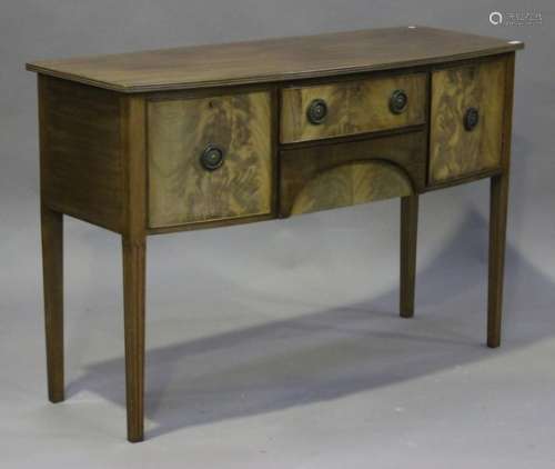 An early 20th century George III style mahogany bow front sideboard, fitted with four drawers,