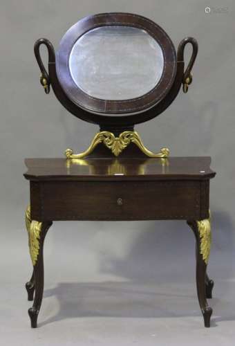 A 20th century Empire style mahogany swing frame dressing table, fitted with a drawer, on