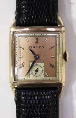 A Gruen Precision gilt metal curved square cased wristwatch with signed jewelled movement, the