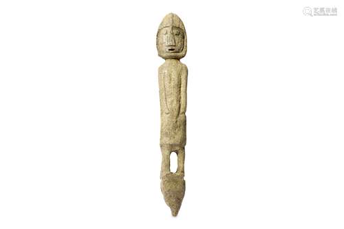 A CARVED ESKIMO BONE FIGURINE