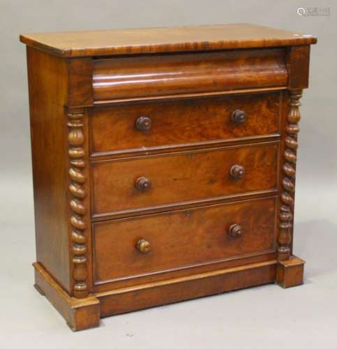 A Victorian mahogany chest of four long drawers, flanked by barley twist pilasters, on a plinth