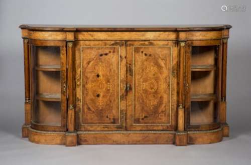 A mid-Victorian walnut credenza with gilt metal mounts, the breakfront top above a pair of inlaid