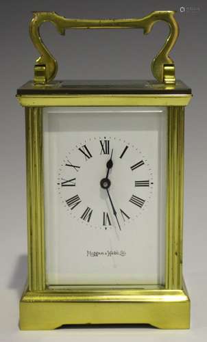 A 20th century brass carriage timepiece with eight day movement, the white dial with Roman