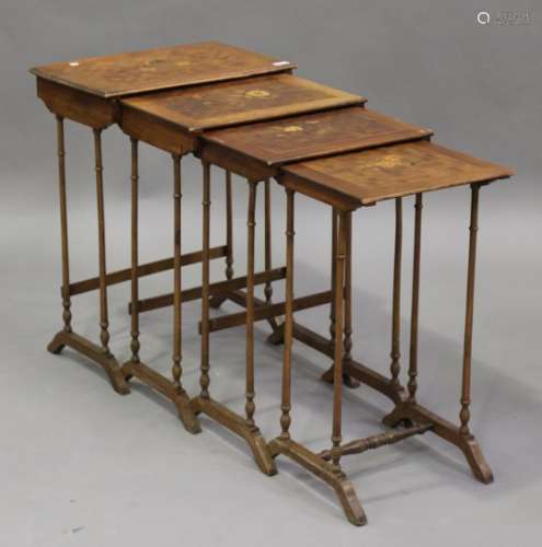 An early 20th century French walnut and marquetry inlaid quartetto nest of occasional tables, on