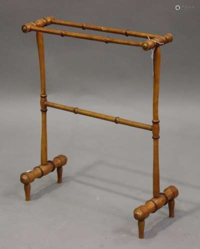 An early 20th century French faux-bamboo turned towel rail, height 75cm, width 57cm, depth 20cm.